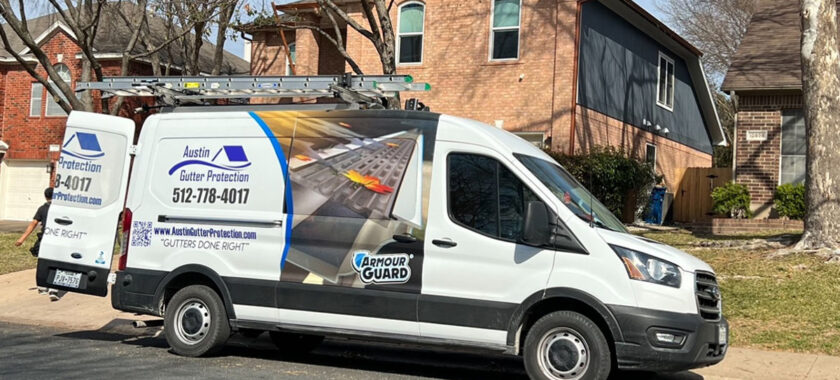 a gutter inspections company truck parked on a residential street