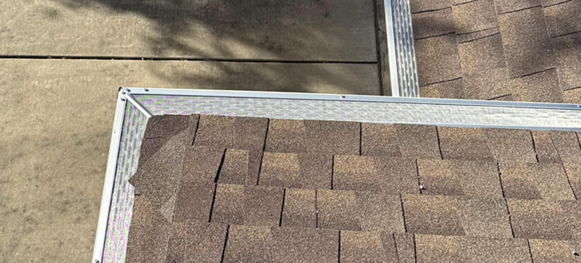 Seamless roof gutter with leaf guards.