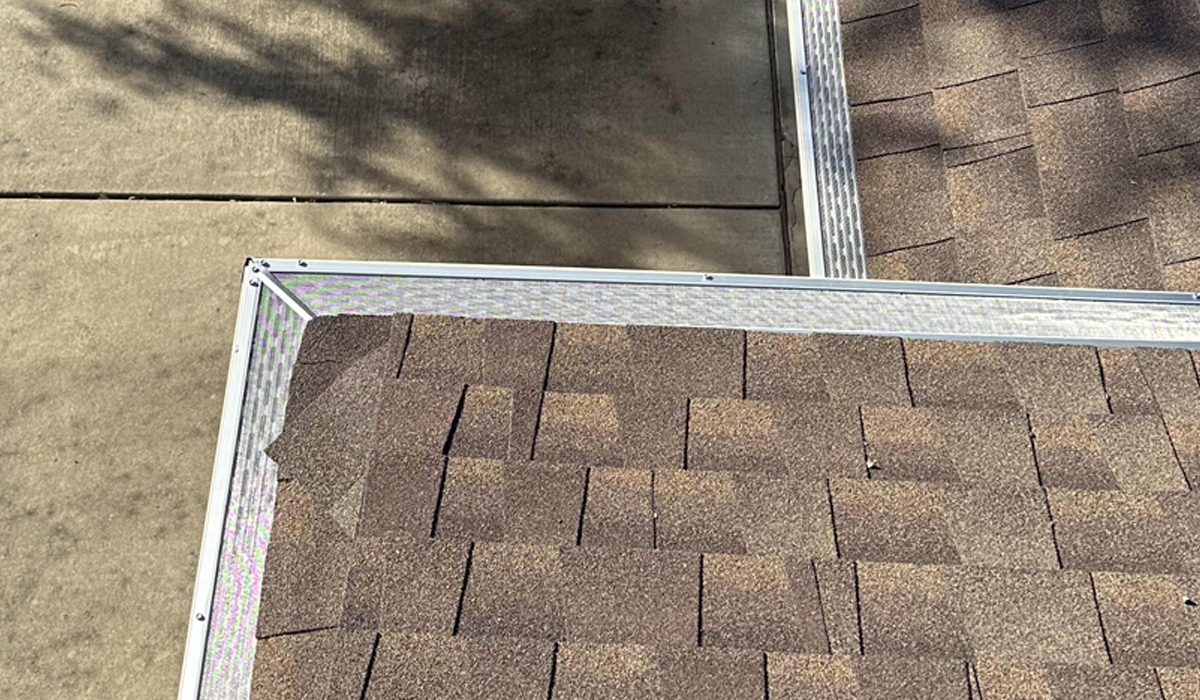 Seamless roof gutter with leaf guards.