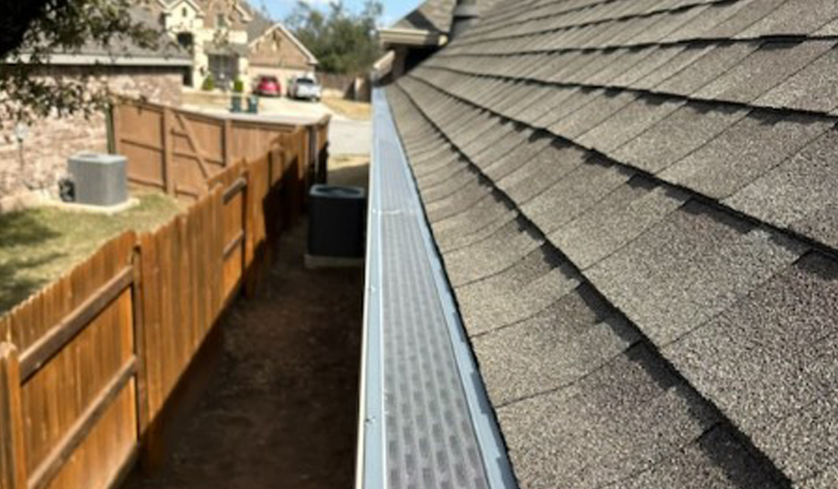 Roof gutter with gutter guards.
