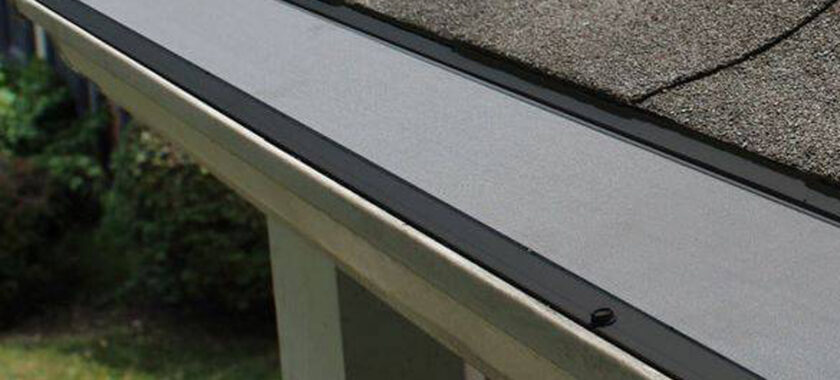 seamless gutter cover on a house roof
